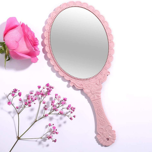 Espejo de mano ovalado decorativo rosa